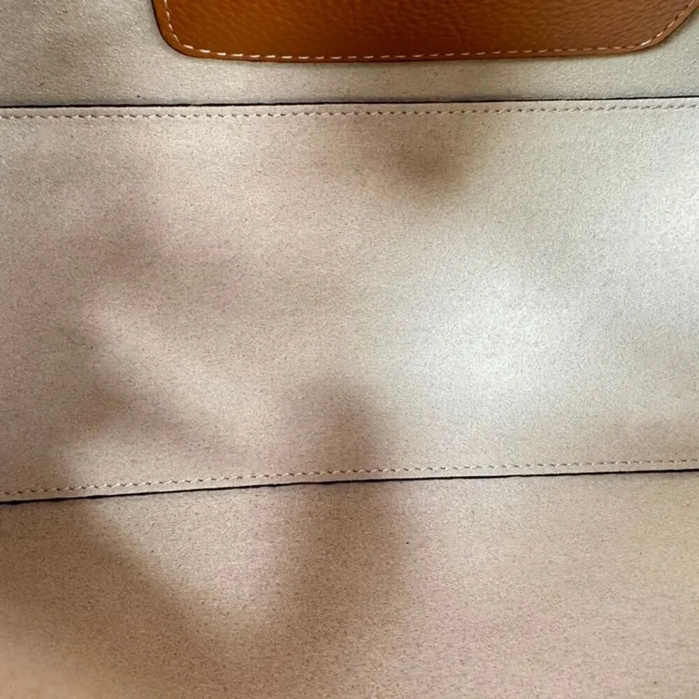Totême T-Lock Grained-Leather Clutch in Tan Brown Leather